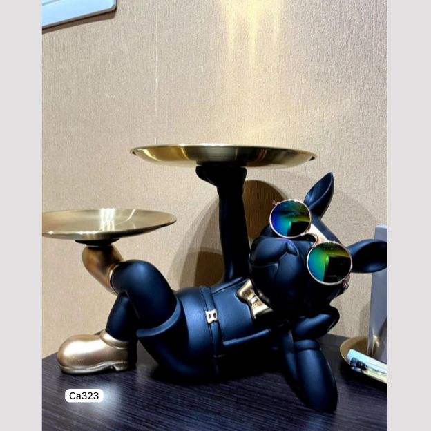 Articulo decorativo perro negro acostado brazo izquierdo 29cm* 19cm* 19cm